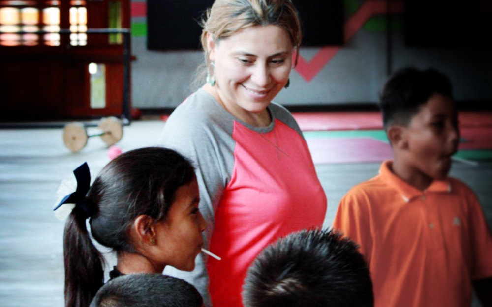 Emelina preparing to pray with kids at the after-school program